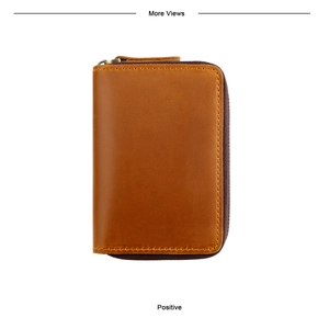 Detailed macro view of the premium brown genuine leather texture with U-shaped zipper
