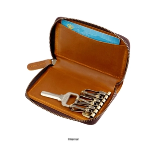 Interior detail of brown leather key case with six vintage hooks and card slot