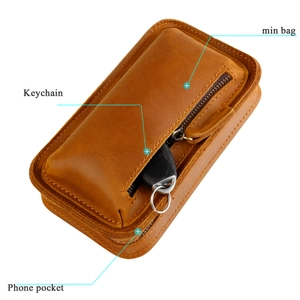Detail view of crazy horse leather phone bag showing main bag and keychain hook