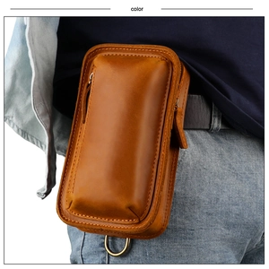 Detail of crazy horse leather phone holster showing double-row stitching and belt loop