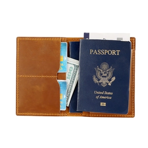 Internal view of a leather passport holder with slots for cards, cash, and AirTag tracking