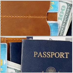 Detailed view of brown leather passport holder with AirTag slot and multiple card slots