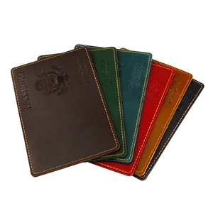 Detailed fan-shaped display of multi-color leather passport covers with US emblem embossing