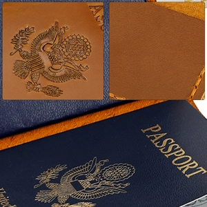 Detailed macro view showing the embossed USA Great Seal and neat stitching on brown leather