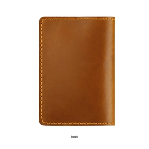 Detailed back view of brown genuine leather passport holder with orange hand-stitched seams
