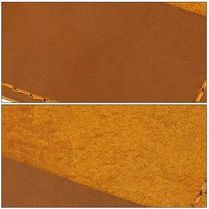 Detailed macro view of genuine leather texture and orange hand-stitched seams on passport cover