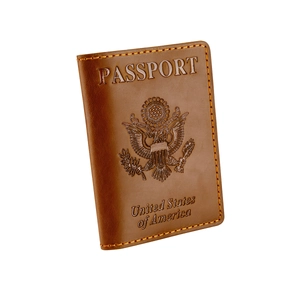 Brown leather US passport holder cover with embossed Great Seal of the United States