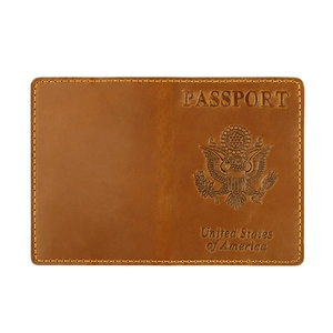 Vintage brown leather US passport cover with embossed Great Seal and durable stitching