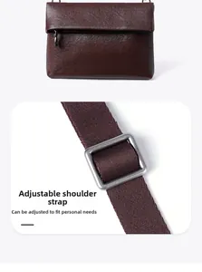 Vue détaillée de la bandoulière réglable et boucle en bronze sur le sac en cuir