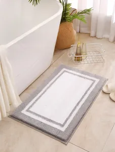 Detailed close-up showing the thick, soft grey and white fluff of the absorbent bath mat