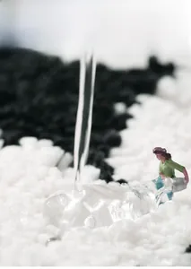 Macro view of plush black and white flocking rug showing rapid water absorption detail