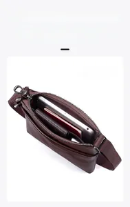 Detail view of large capacity men's messenger bag with multiple interior compartments