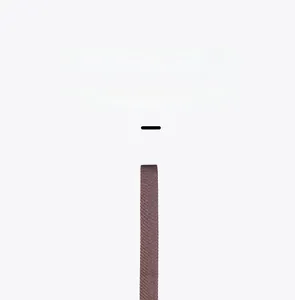 Close-up of the durable brown woven shoulder strap for the slim crossbody bag