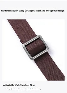 Macro detail of brown woven wide shoulder strap with vintage metal buckle