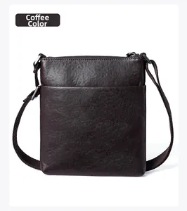 Detail view of coffee brown leather messenger bag with back pocket and silver zipper
