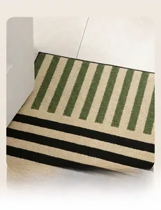 Close-up of modern striped bath mat texture with thick tufted green and black fibers