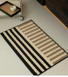 Close-up of geometric striped tufted bath mat with non-slip texture in modern home interior