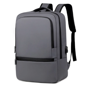 Gray business backpack with USB charging port and multiple storage compartments