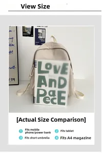 Size view of cream backpack compared to A4 notebook showing its large capacity
