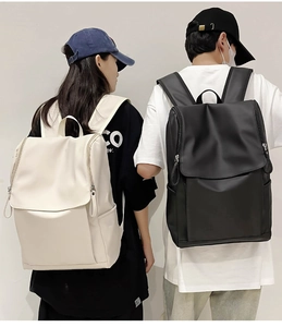 Waterproof fabric backpacks in black and beige showing flap covers and side zippers