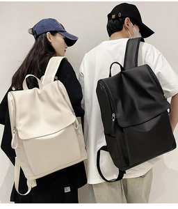 Waterproof travel backpacks in black and beige shown on models for urban commuting