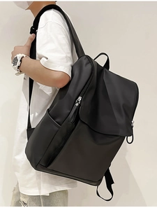 Outdoor travel backpack for women in high-density nylon shown in a minimalist street style