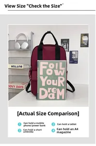 Deep red backpack capacity detail showing size compared with A4 notebook and tablet