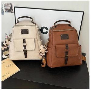 Retro PU leather backpacks in beige and brown with rivet details and cute bear charms