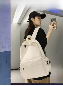 Detailed shot of cream-colored large capacity backpack with multiple utility pockets