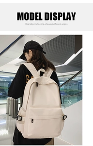 Detail of beige minimalist backpack with side mesh pockets and adjustable buckles