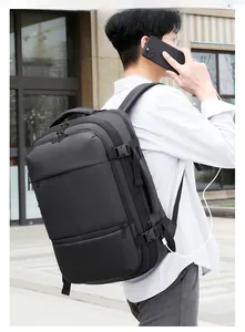 Detail of black business backpack featuring side buckles and external USB charging port