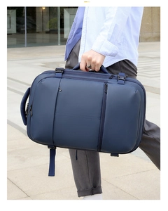 Detail of dark blue waterproof travel backpack with side handles and buckles