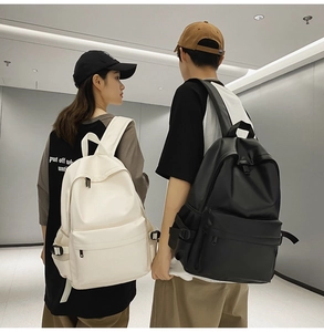 Minimalist black and white soft leather backpacks shown from behind on male and female models