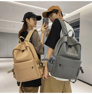 Dual view of gray and brown soft leather backpacks showing size and fit on models
