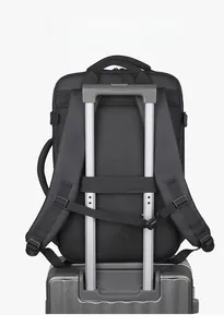 Detail of the back luggage strap and adjustable shoulder buckles on a black laptop backpack