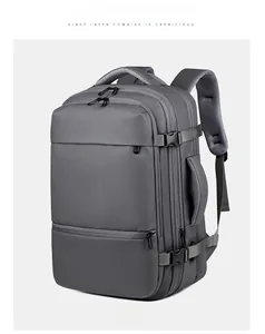 Vue détaillée du sac à dos gris en nylon imperméable avec boucle latérale et poignée