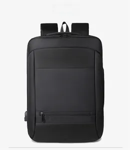 Front detail of black business backpack showing high-density nylon fabric and USB port