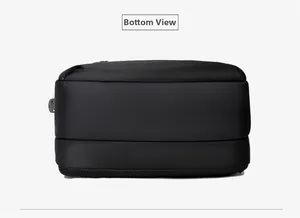 Detailed bottom view of black business backpack showing high-density nylon fabric texture