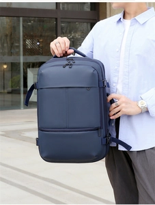 Sac à dos professionnel bleu marine imperméable avec poignée rembourrée et compartiments divers