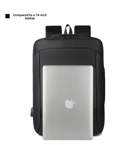 Detail of black business laptop backpack showing 14-inch laptop size comparison and USB port