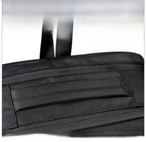 Close-up of the reinforced padded handle on a black business backpack with durable texture