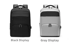 Detailed view of dual USB charging ports and fabric texture on black and grey business backpacks