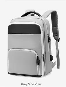Detail view of the gray business backpack with built-in USB charging port and zipper pockets