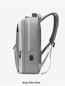 Grey waterproof laptop backpack side view with integrated USB external charging port