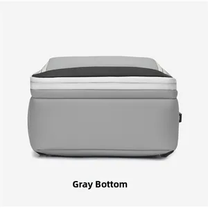 Detail view of the durable grey nylon backpack bottom with expandable zipper section
