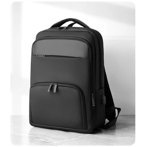 Close-up of business backpack showing external USB charging port and waterproof texture