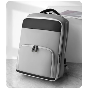 Detail view of business backpack with USB charging port and expandable layered compartments