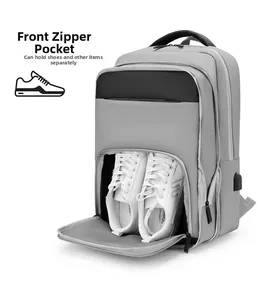 Detailed view of grey business backpack showing independent front shoe compartment and USB port