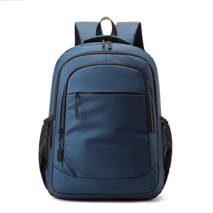 Detailed front view of navy blue backpack showing storage pockets and side mesh holder