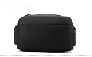 Detail view of the waterproof black business backpack's durable bottom and stitching